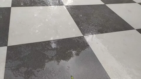 4K Video of rain water fall on the tiles in home floor. Video stock 138032224