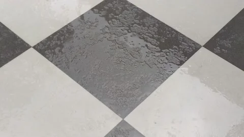 4K Video of rain water fall on the tiles in home floor. Video stock 138032354