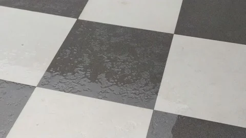 4K Video of rain water fall on the tiles in home floor. Video stock 138032441