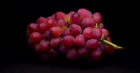 4K Video of red grapes on a turntable against a black background. Stock Footage 199533633