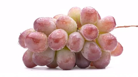 4K Video of red grapes on a turntable against a white background. Stock Footage 308050864