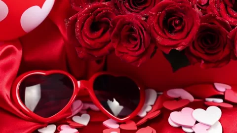 4K video of red roses in a gift box on red background Stock Footage 342107475