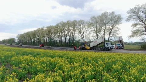 4K video. Side view of road works with asphalt paver Stock Footage 130200281