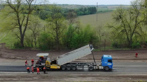 4K video. Side view of road works with asphalt paver Stock Footage 130201503