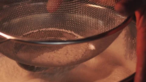 4k video sifting flour with a sifter. Food preparation concept. Stock Footage 262653194
