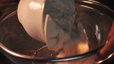 4k video sifting flour with a sifter. Food preparation concept. Stock Footage 262653224