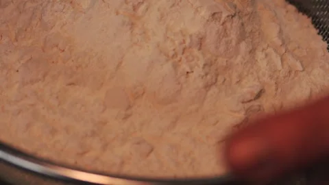4k video sifting flour with a sifter. Food preparation concept. Stock Footage 262653264