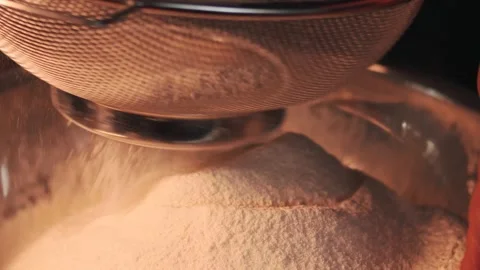 4k video sifting flour with a sifter. Food preparation concept. Stock Footage 262653269