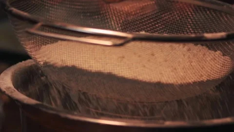 4k video sifting flour with a sifter. Food preparation concept. Stock Footage 262653364