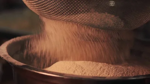 4k video sifting flour with a sifter. Food preparation concept. Stock Footage 262653365