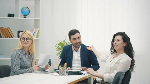 4k video sitting at negotiation table express gratitude at team office meeting. Stock Footage 137806770