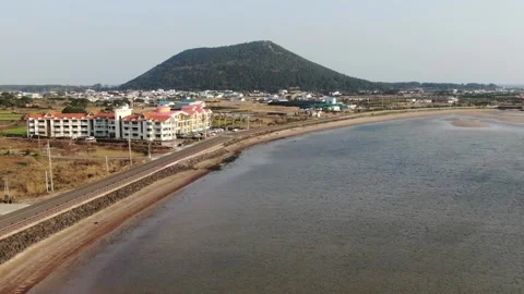 4K video from the sky by flying a drone on Jeju Island's wonderful and beach_4 Stock Footage 280113098