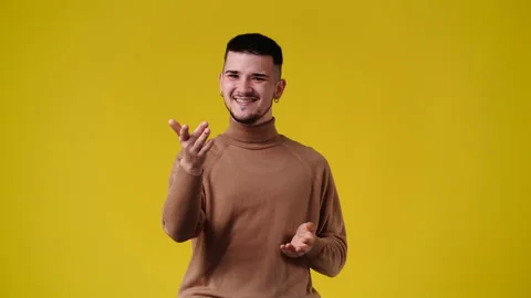 4k video of smiling man over yellow background. Stock Footage 235386434