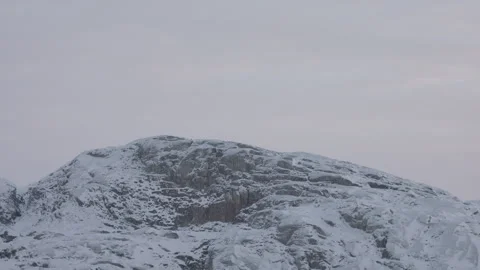 4K Video of Snow-Dusted Rocky Mountain Peak at Dawn Stock Footage 314516587