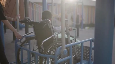 4K Video Of Special Swing For Disabled Children In Wheelchair On Playground In Stock Footage 252629980