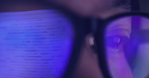 4K video super close up eye ball with eyeglasses reflect coding screen. Backg 스톡 동영상 172780806