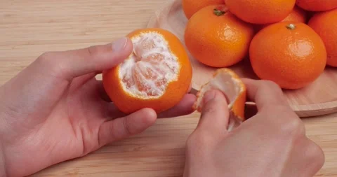 4K video of tangerine peeling on a table. 스톡 동영상 225072071