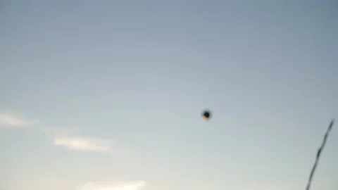 4k video Team playing beach valleyball on sunset. Youth having fun on beach at Stock Footage 212171987