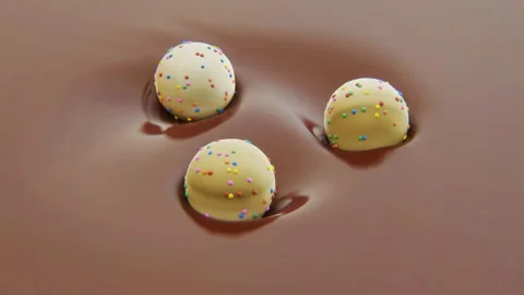 4k video of three sweets in motion in chocolate. Stock Footage 166557225