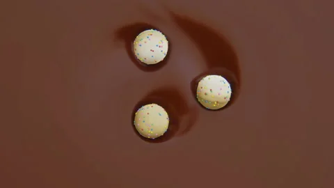 4k video of three sweets in motion in chocolate. Stock Footage 170902206