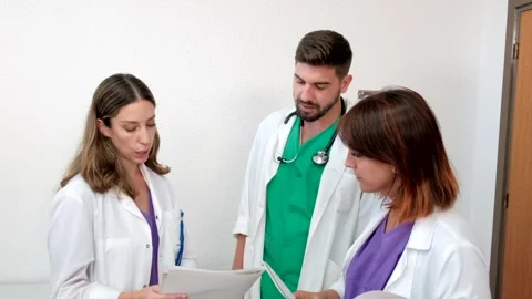 4K Video of three young and happy doctors working in a hospital. Stock Footage 282039413