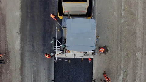 4K video. Top view of road works with asphalt paver. Stock Footage 130202253