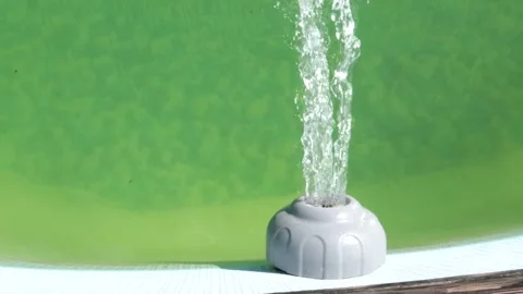 4k video, top view of the water drain filter in the outdoor pool, the concept of Stock Footage 253615647