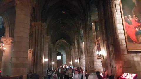 4k video Tourists Visit The Interior Of Notre Dame Cathedral in Paris Stock Footage 89653693
