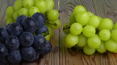 4K video of two types of grapes on a table while slowly moving the camera. Stock Footage 241546120