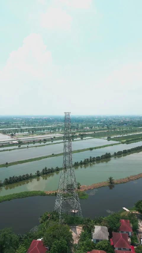 4K Video vertical aerial drone shot of high voltage pole in Thailand. Video stock 208763363