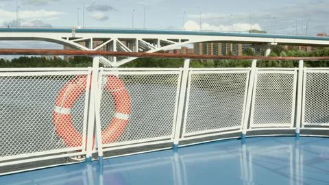 4k video, view from the deck of a river cruise ship of a bridge with car traf Stock Photos