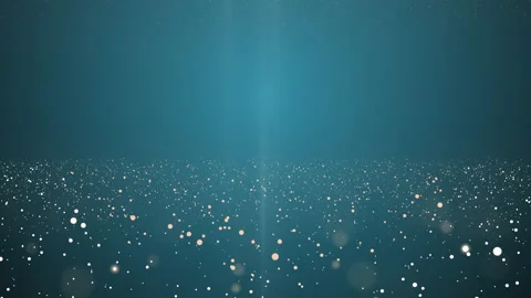 4k video where particles fly up and sparkle on a blue background. Stock Footage 134966537