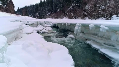4K Video Of Winter River And Snow Covered Rocks In Xinjiang,China,Asia. Video stock 145968136