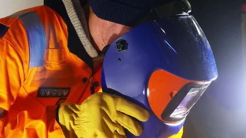 4k video of young caucasian Worker preparing for welding in a factory. Stock Footage 73136451