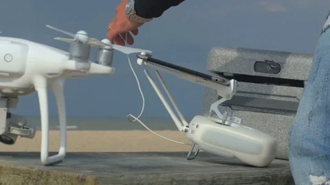 4k video of Young engineer is preparing quadrocopter for fly Video stock 83924481