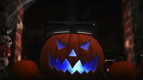 4k vidoe of pumpking changing colours on spooky fire place. wram flickering Stock Footage 139837256