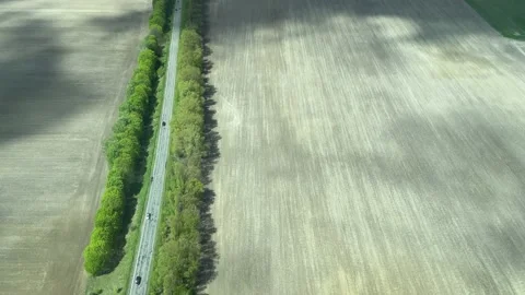 4k View from airplane to the fields and road with cars. Stock Footage 154656793