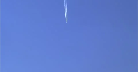 4K View of Airplane jet layer, aircraft pollution on sky, white trace vapour by Stock Footage 242146699