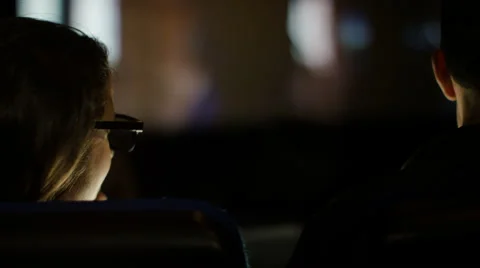 4K View from behind of couple in cinema watching action movie with 3D glasses Stock Footage 59711562