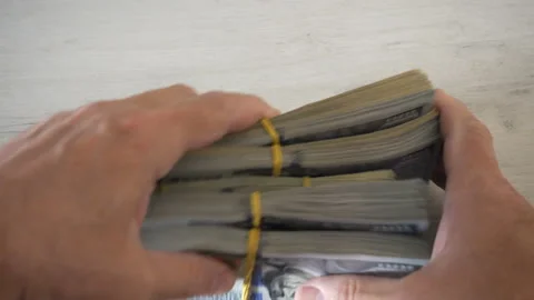 4K view of bundles of dollar bills in the hands Stock Footage 199678545