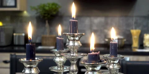 4K view of burning candles in a silver candelabra Stock Footage 88547169
