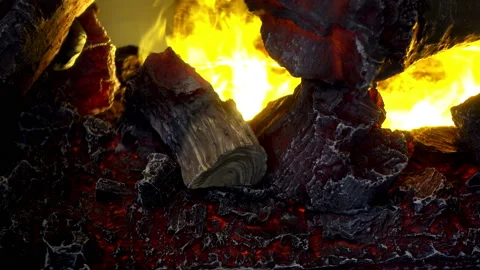 4K view of burning logs with a bright orange flame of close-up Stock Footage 87609832