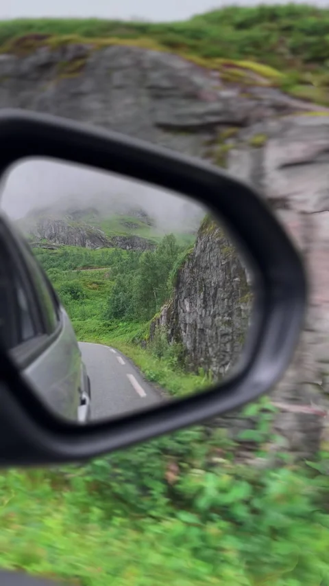 4K View from Car Mirror, Surrounded by Lush Valleys and Mountains in Norway Stock Footage 296009100
