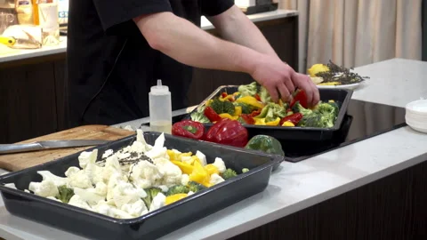 4K view of chef mixes vegetables for cooking. Stock Footage 87257124