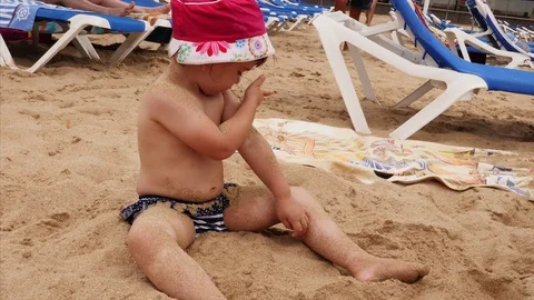 4K View Child Playing in Sand at Beach Happy Caucasian Little Girl, Kid Having F 動画素材 78761259