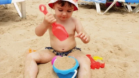 4K View Child Playing in Sand at Beach Happy Caucasian Little Girl 스톡 동영상 78761305