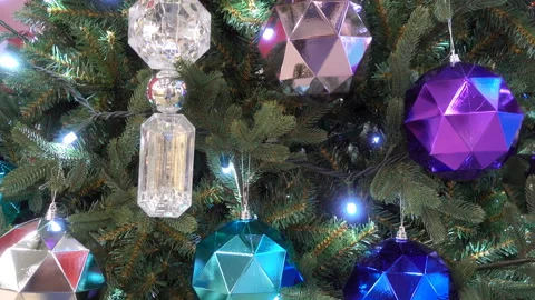4K view of a Christmas tree decorated with colorful faceted balls Stock Footage 164377609