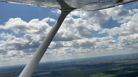 4K View on clouds and land from small airplane. Stock Footage 156545062