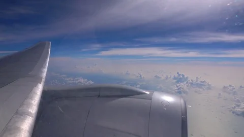 4K view on cloudscape and airplane wing with engine 動画素材 75896057