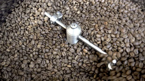 4K view of coffee beans are mixed in the drum of the roasting machine. Stock Footage 101612396